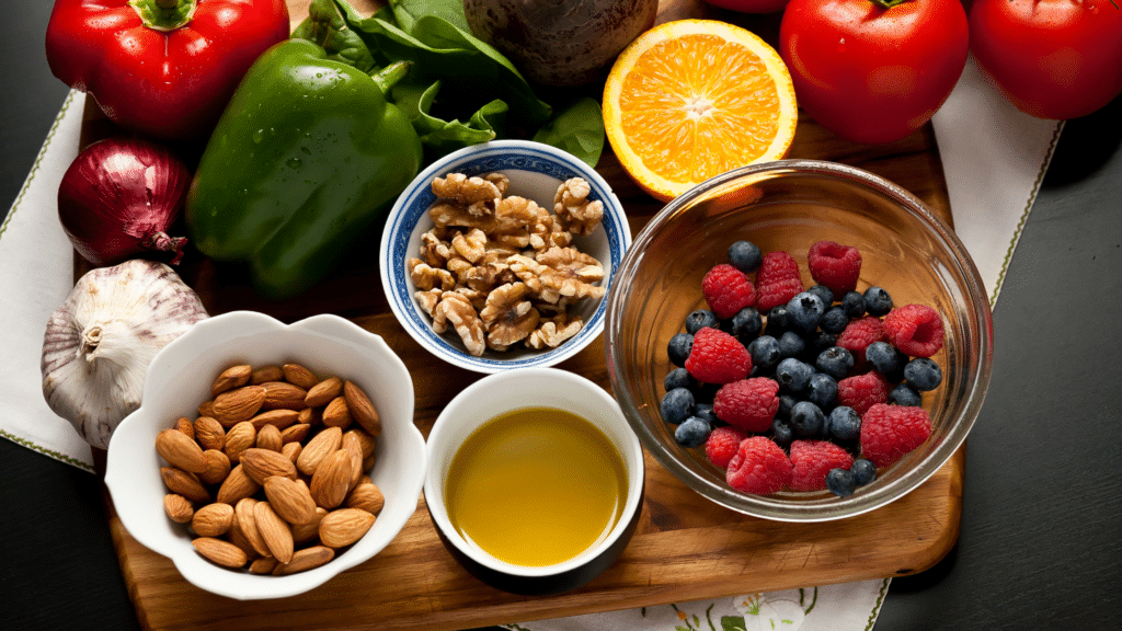 Assorted anti-inflammatory foods, including berries, leafy greens, nuts, and fatty fish